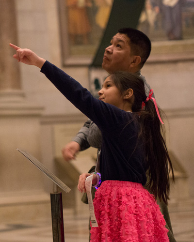 Young visitor points to a detail in the Rotunda