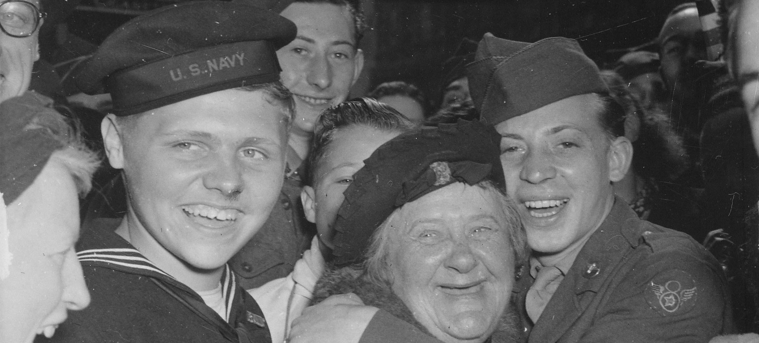 Jubilant American soldiers, seamen and civilians celebrating Germany's unconditional surrender at London, England, May 7, 1945