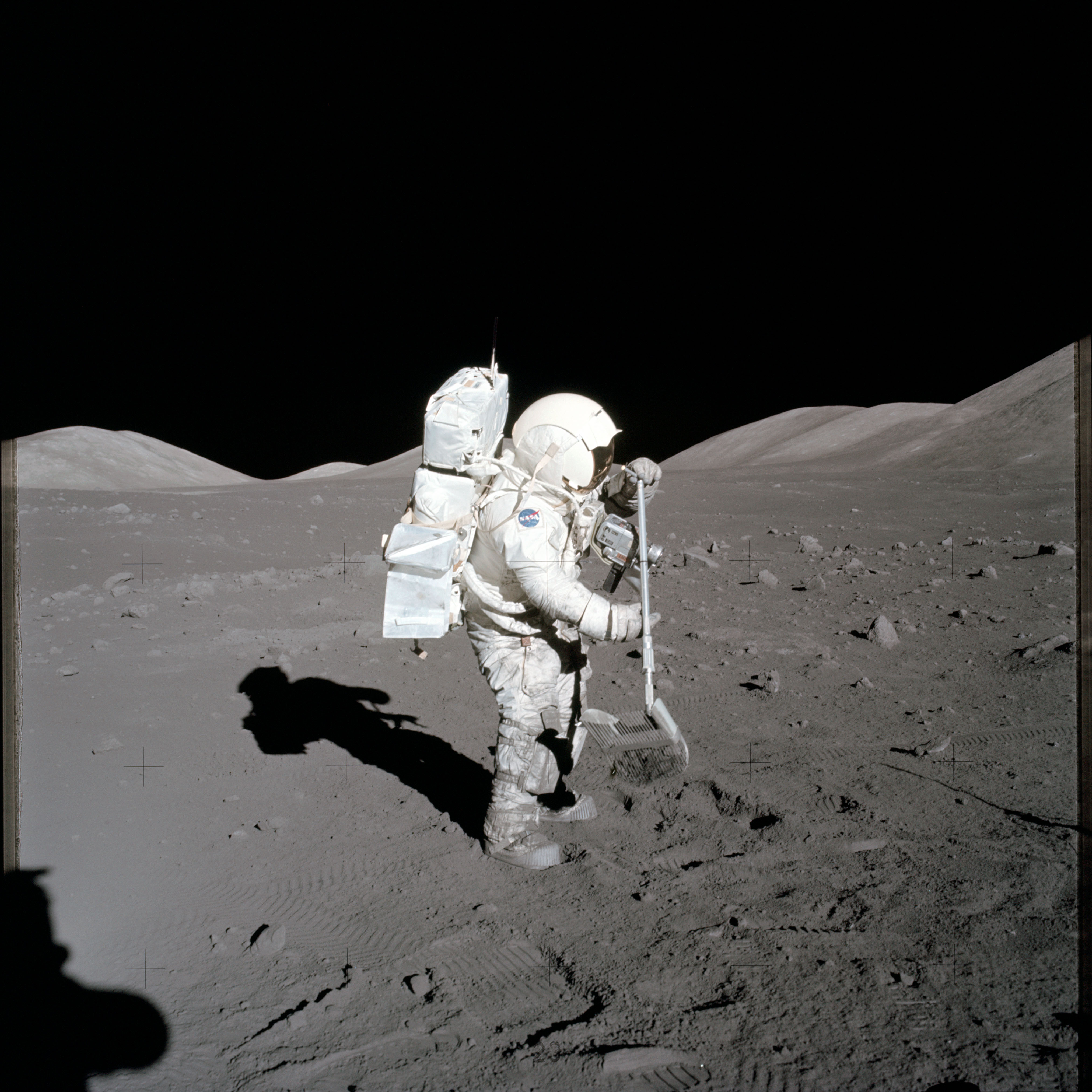 Photograph of Apollo 17 scientist-astronaut Harrison H. Schmitt collecting lunar rake samples, December 1972