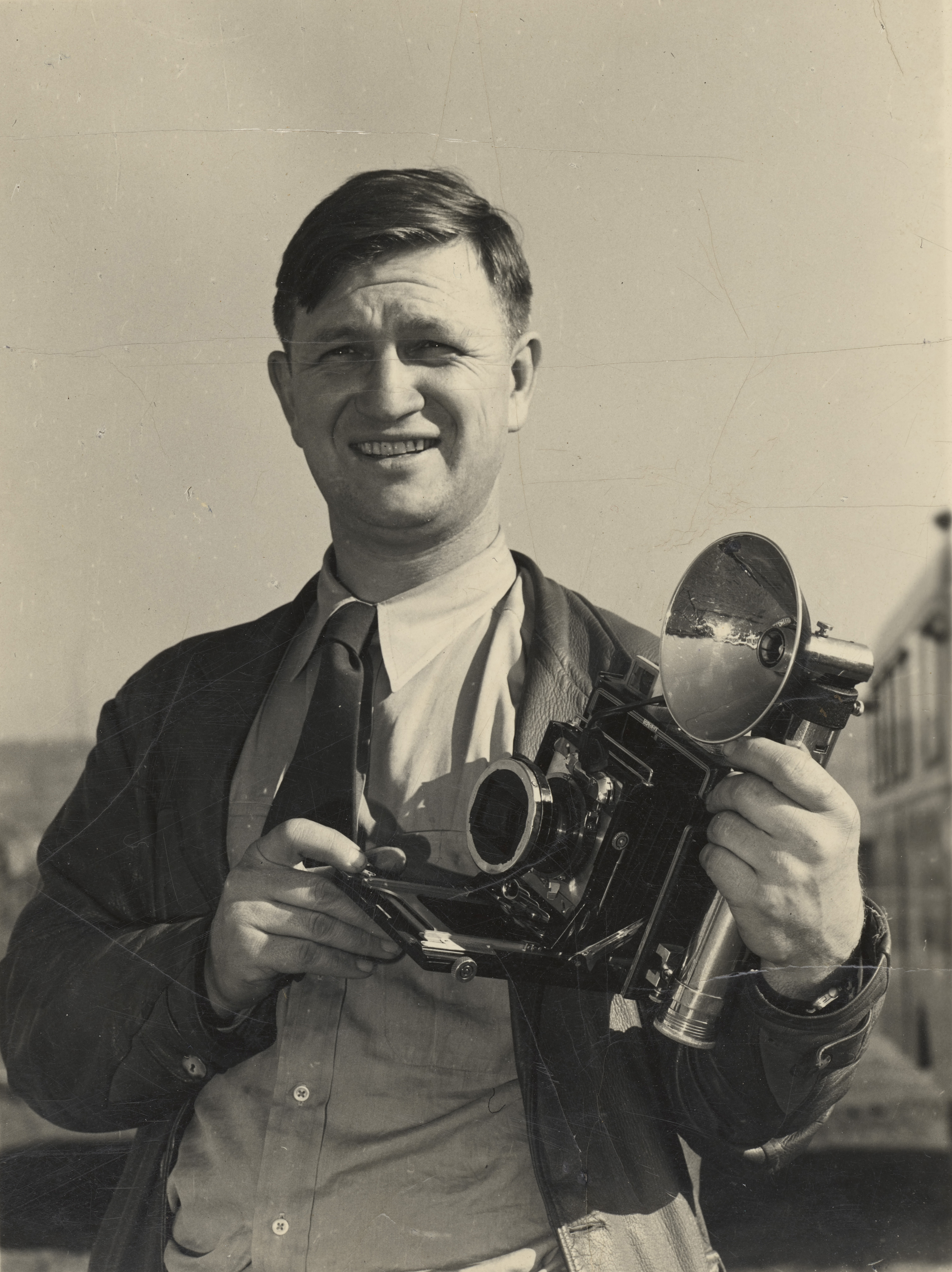 Man standing with camera.