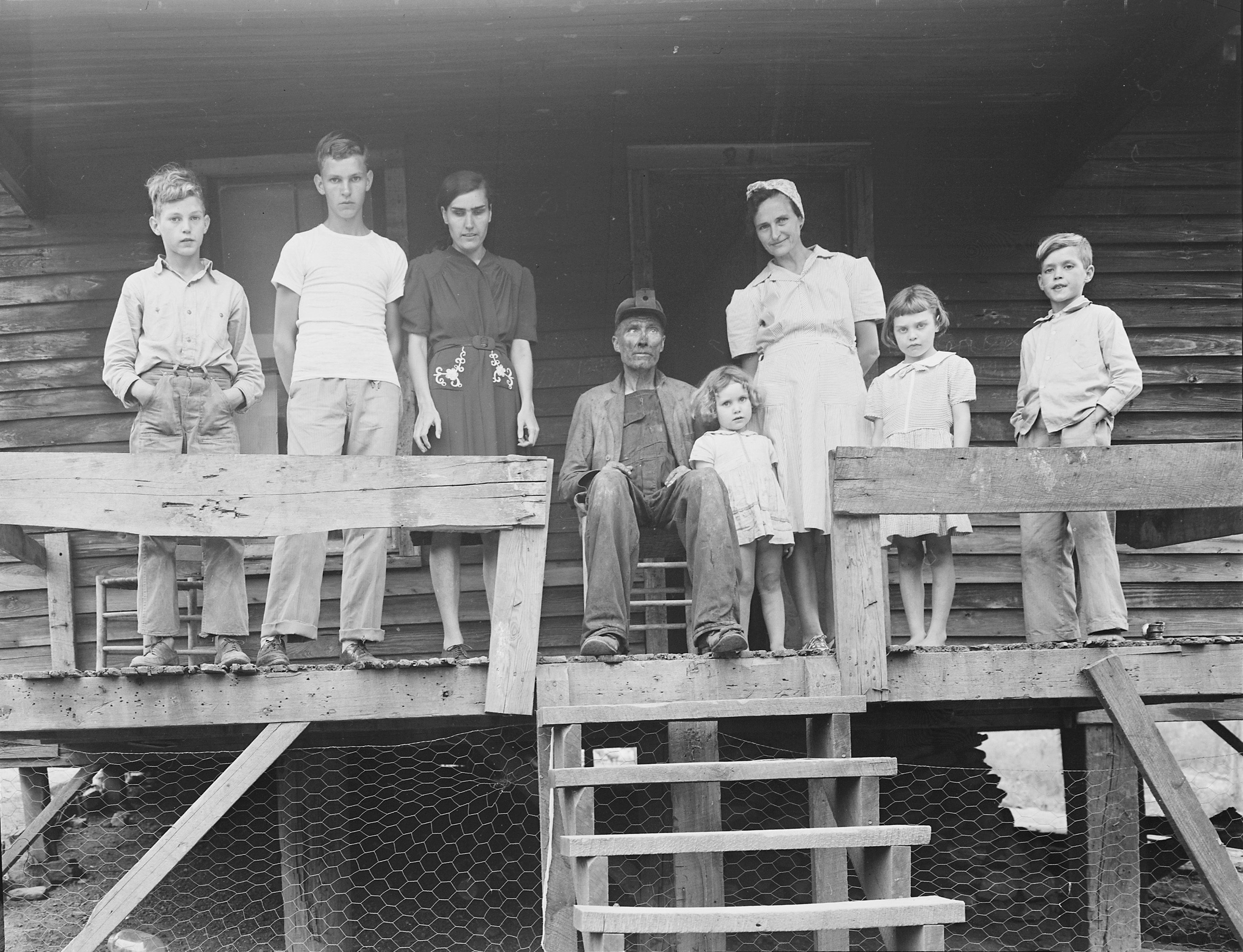 Miner family on their front porch.