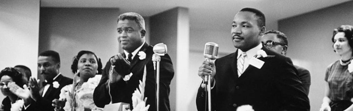 Dr. Martin Luther King, Jr., with Jackie Robinson on his right, Southern Christian Leadership Conference Convention, 1962 